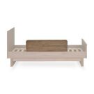 Quax uitvalbeschermer walnut 90 cm achteraanzicht van bed