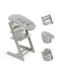 Een grijze babyset op een Stokke Tripp Trapp stoel