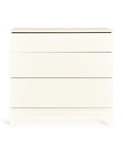 Witte commode met drie lades in zijaanzicht