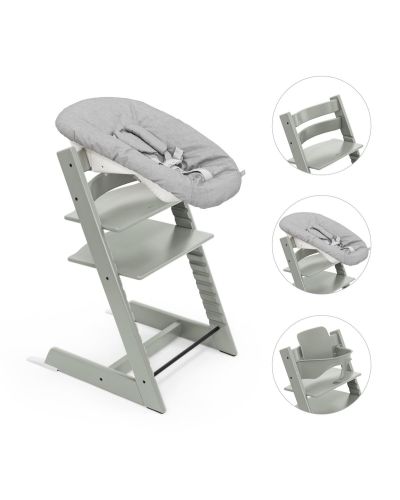 Een grijze babyset op een Stokke Tripp Trapp stoel